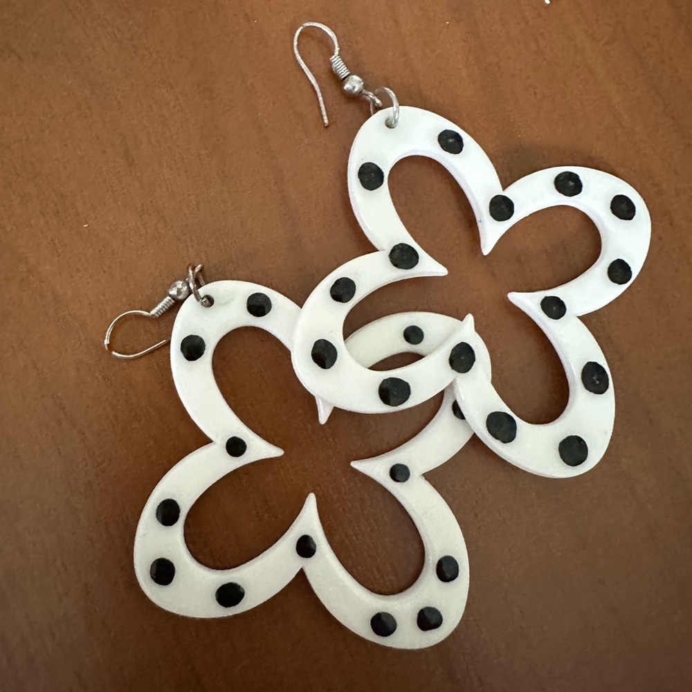 White Floral Cutout Drop Earrings with Black Dot Accents